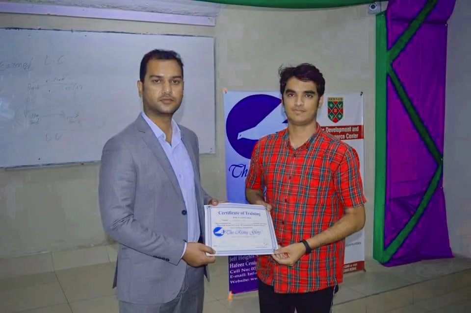 A participant receiving a training certificate